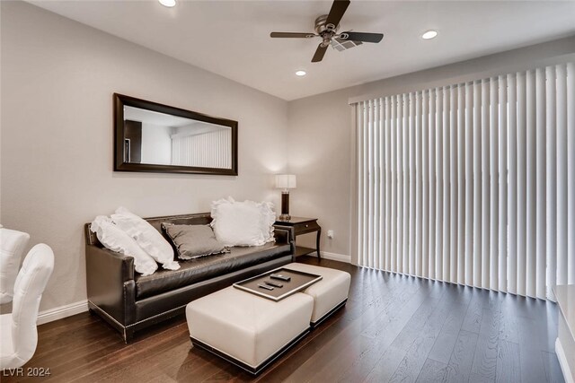 living room with ceiling fan and hardwood / wood-style floors