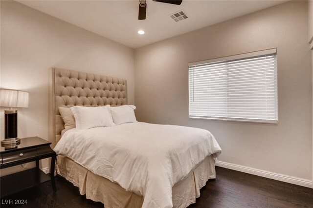 bedroom with ceiling fan and dark hardwood / wood-style flooring