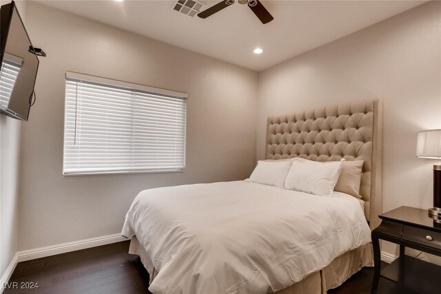 bedroom featuring ceiling fan and dark wood-type flooring