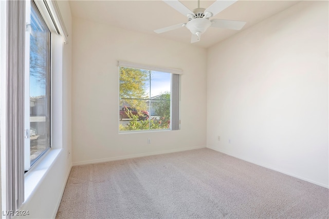 spare room with carpet and ceiling fan