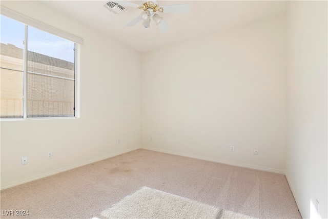 carpeted empty room with ceiling fan