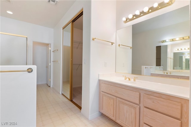 bathroom featuring tile patterned floors and vanity