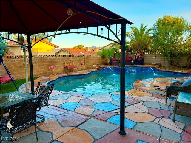 view of pool featuring a gazebo, a fenced in pool, a patio, and a fenced backyard