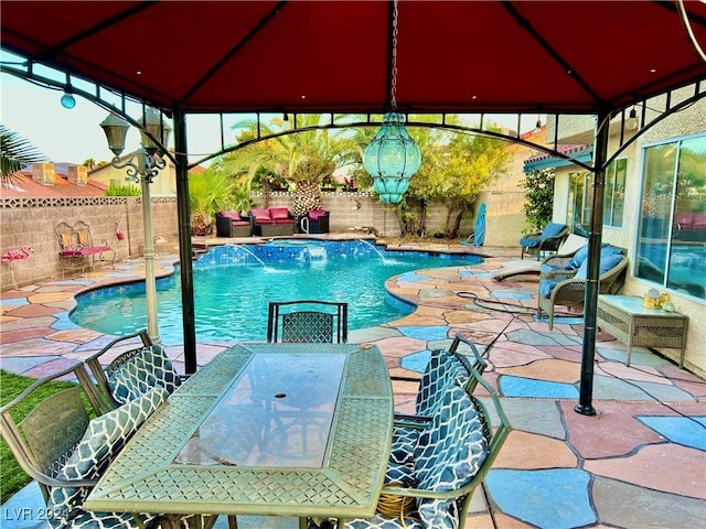 view of pool with a gazebo, outdoor dining space, a patio area, and a fenced backyard