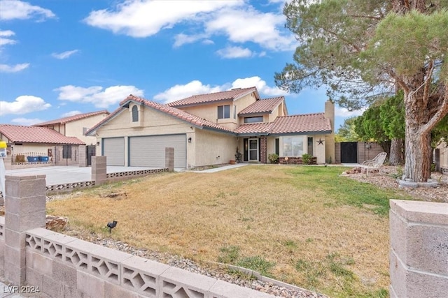 mediterranean / spanish home featuring a front lawn, fence, stucco siding, a garage, and driveway