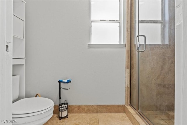 bathroom with tile patterned flooring, a stall shower, and toilet