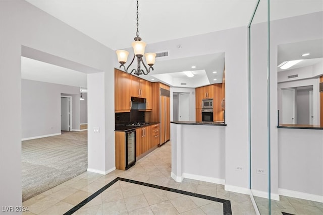 kitchen featuring decorative light fixtures, appliances with stainless steel finishes, light carpet, beverage cooler, and decorative backsplash