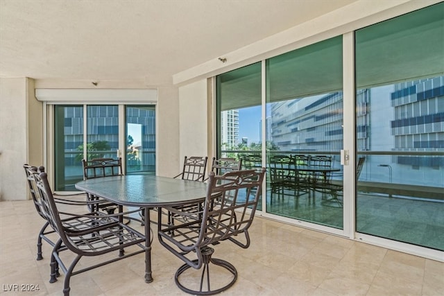 exterior space with a textured ceiling and light tile patterned flooring