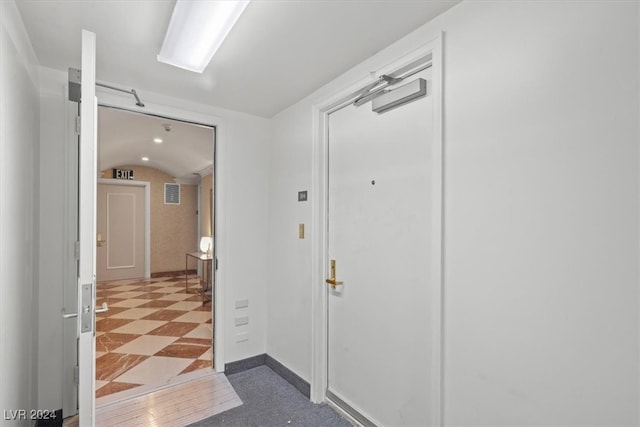 hallway with light tile patterned floors