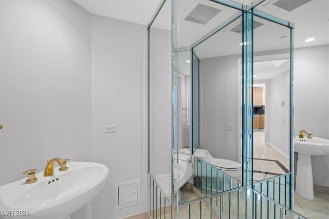 bathroom featuring tile patterned flooring and sink