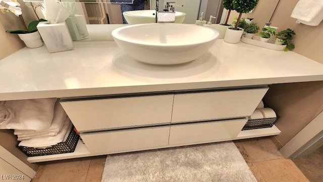 bathroom with tile patterned flooring and vanity