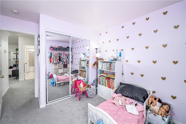 bedroom featuring light carpet and a closet