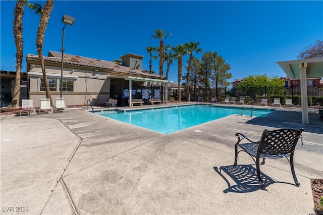 view of swimming pool with a patio area