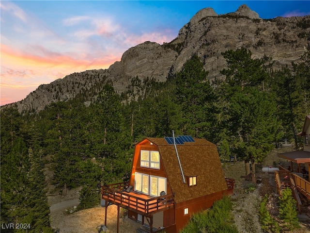 view of mountain feature with a wooded view