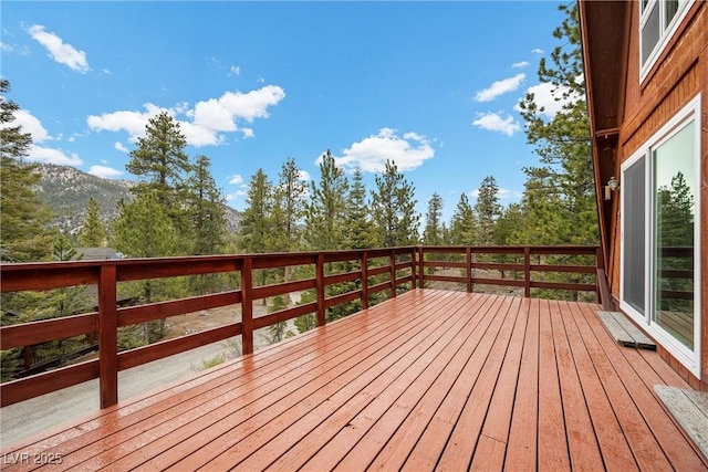 wooden terrace with a mountain view
