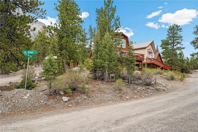 view of property exterior featuring a deck