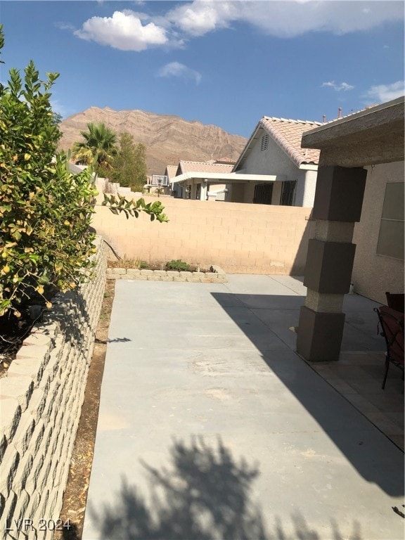 view of patio / terrace featuring a mountain view