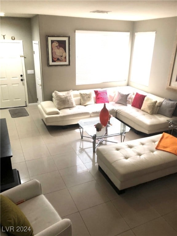 living room with tile patterned floors