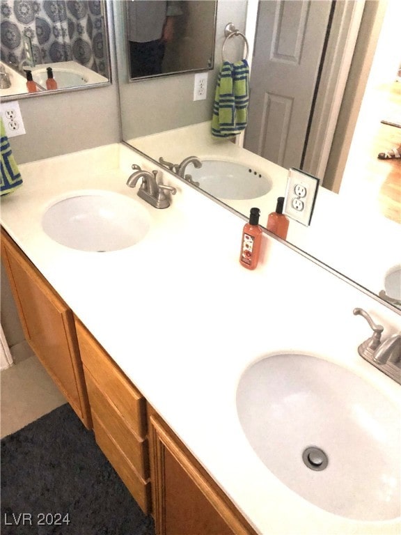 bathroom with vanity and tile patterned floors