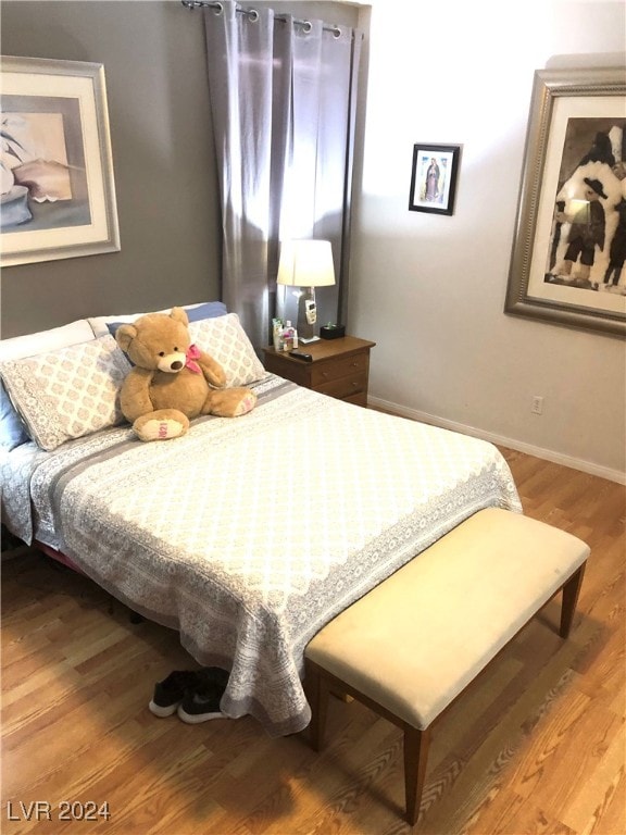 bedroom featuring wood-type flooring