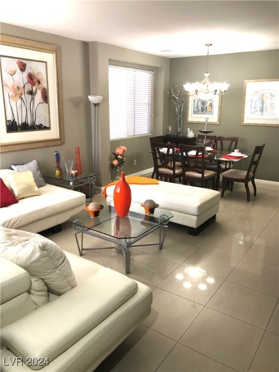 tiled living room with a chandelier