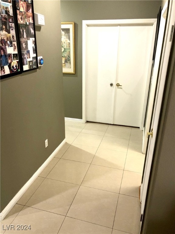 hallway with light tile patterned flooring