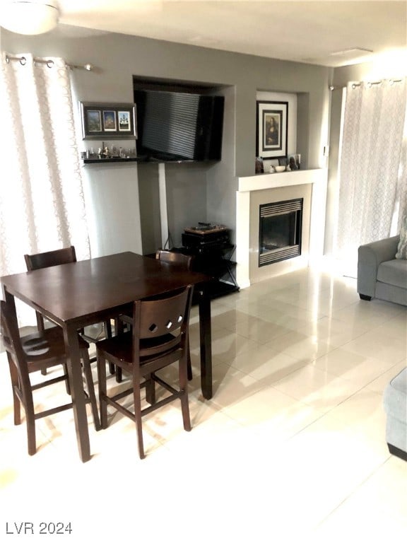 dining area featuring tile patterned flooring