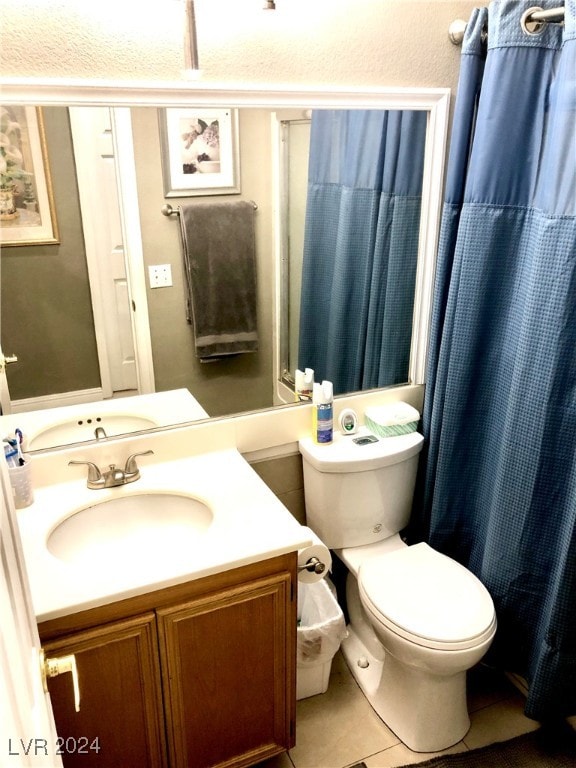 bathroom featuring tile patterned floors, a shower with shower curtain, vanity, and toilet