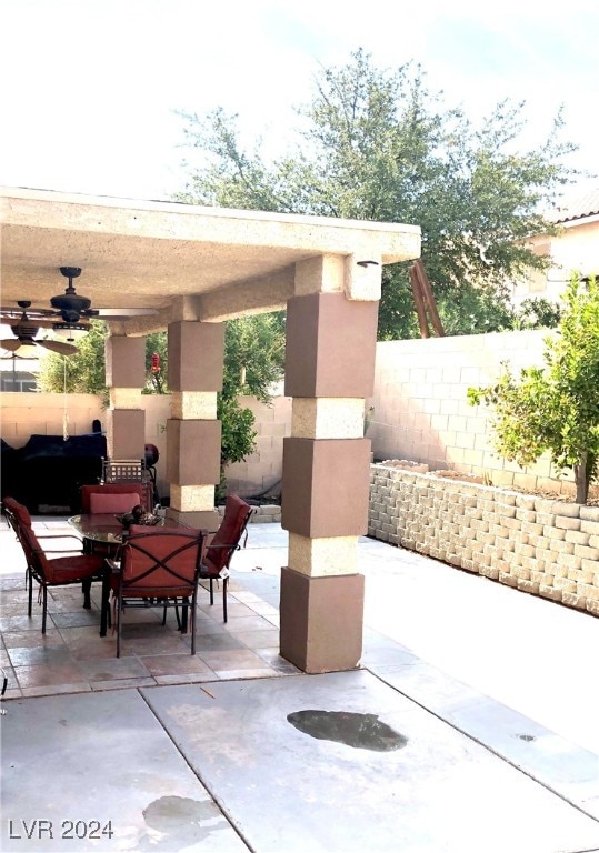 view of patio featuring ceiling fan