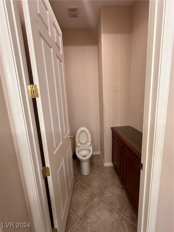 bathroom featuring tile patterned floors and toilet