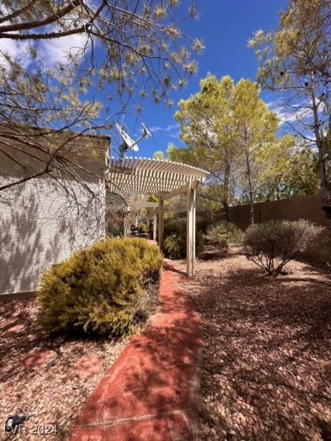 view of property's community featuring a pergola