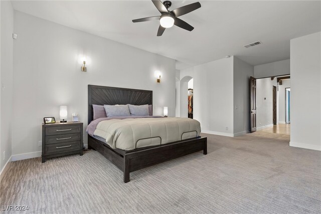 carpeted bedroom featuring ceiling fan