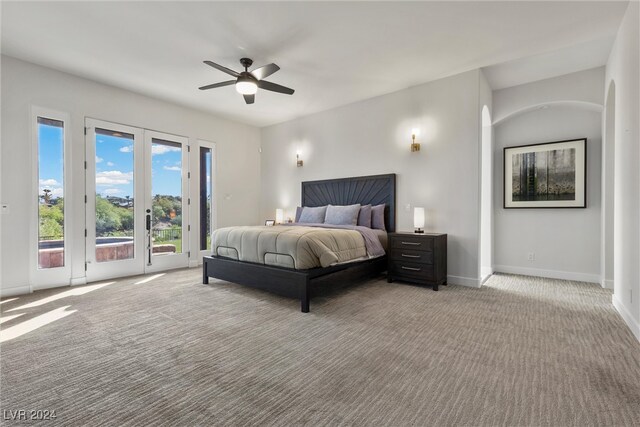 carpeted bedroom featuring ceiling fan, access to outside, and french doors