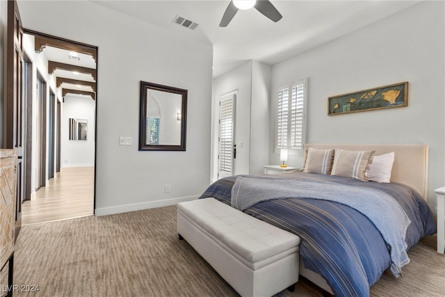 bedroom with ceiling fan and hardwood / wood-style flooring