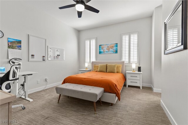 bedroom featuring light colored carpet and ceiling fan