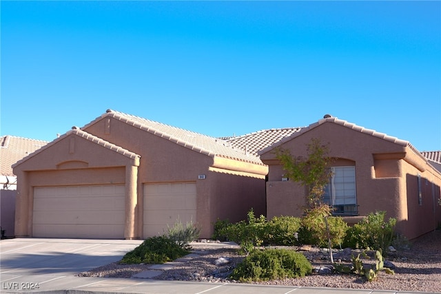 view of front of property with a garage