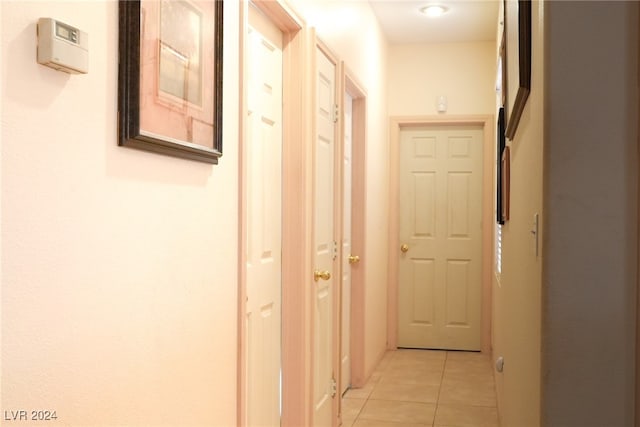 hallway featuring light tile patterned flooring