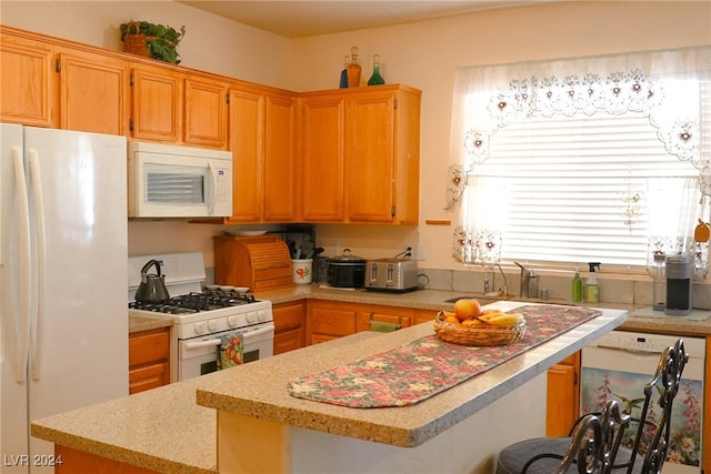 kitchen with sink and white appliances