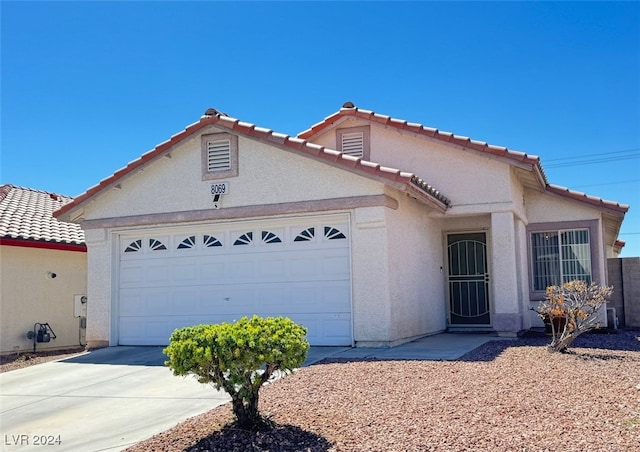 view of front of property with a garage