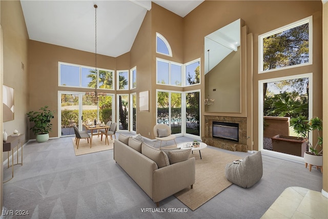 living room with light carpet and a fireplace