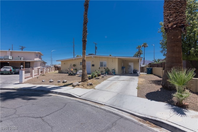 view of front of property with a carport