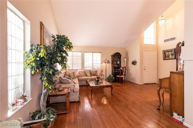 1834 Escondido Ter, Henderson, NV 89074 - living room featuring a wealth of natural light, visible vents, high vaulted ceiling, and hardwood / wood-style flooring