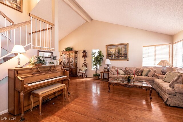 1834 Escondido Ter, Henderson, NV 89074 - living room with stairway, high vaulted ceiling, beamed ceiling, and wood finished floors