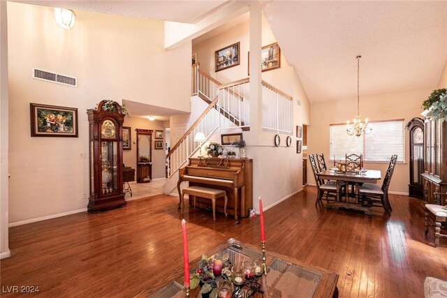1834 Escondido Ter, Henderson, NV 89074 - dining room featuring visible vents, stairs, an inviting chandelier, high vaulted ceiling, and wood-type flooring