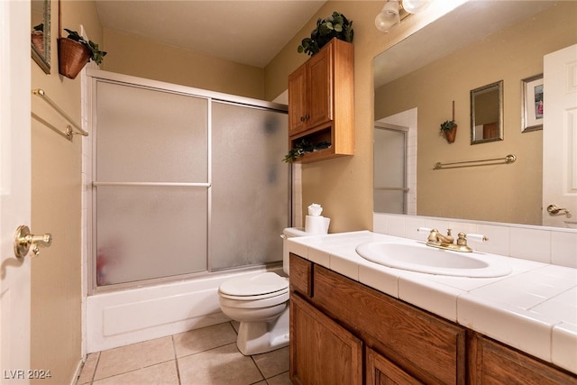 1834 Escondido Ter, Henderson, NV 89074 - full bathroom featuring tile patterned floors, combined bath / shower with glass door, toilet, and vanity