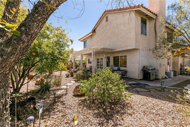 1834 Escondido Ter, Henderson, NV 89074 - rear view of house featuring a patio, a tiled roof, a pergola, and stucco siding