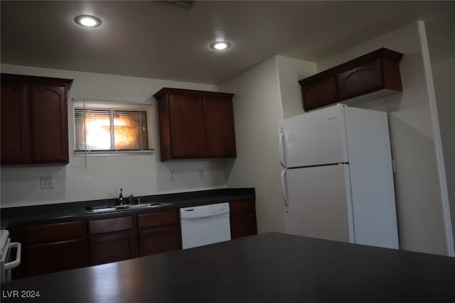 kitchen with sink and white appliances