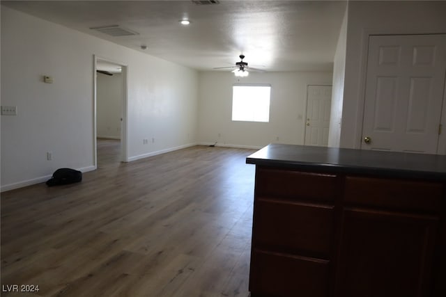 kitchen featuring ceiling fan and hardwood / wood-style flooring