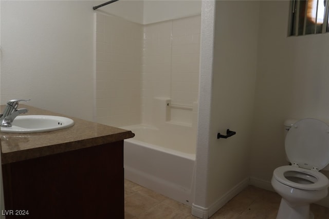 full bathroom with washtub / shower combination, tile patterned flooring, toilet, and vanity