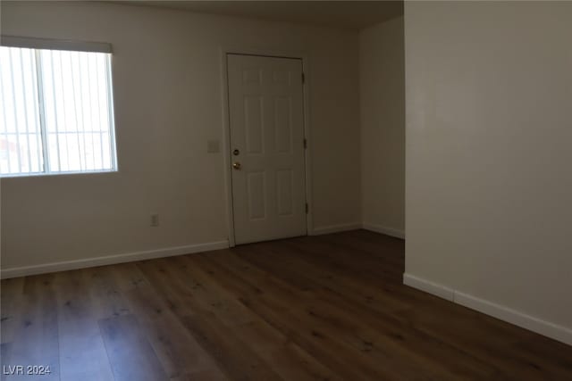 empty room featuring wood-type flooring